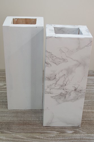 columns covered in marble adhesive paper