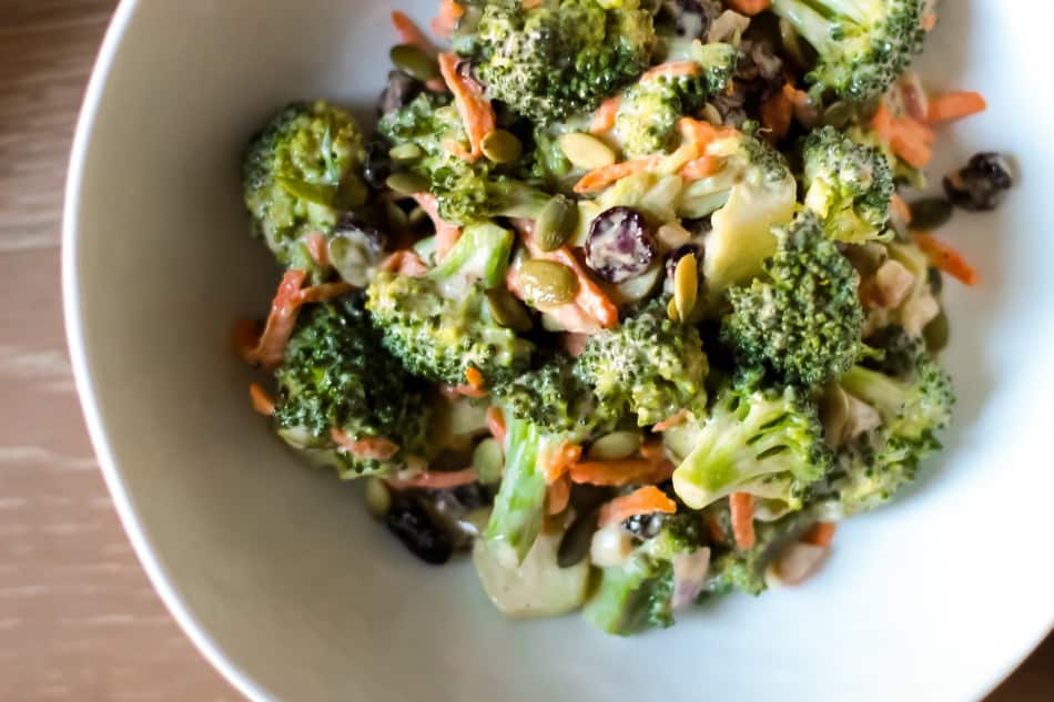 Picture of broccoli salad with shredded carrots in bowl