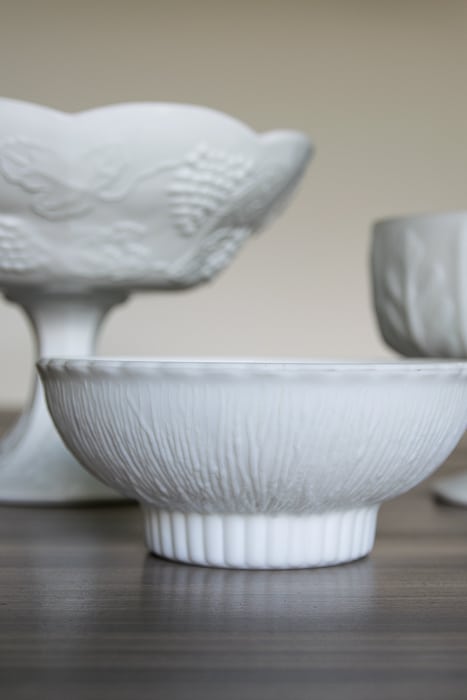 picture showing white pressed glass bowls, varying heights, shapes and textures