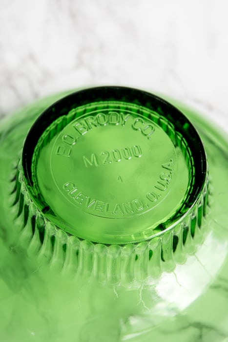 picture showing bottom of a green pressed glass bowl stating Cleveland, Ohio U.S.A.