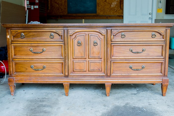 picture of an old dresser in garage