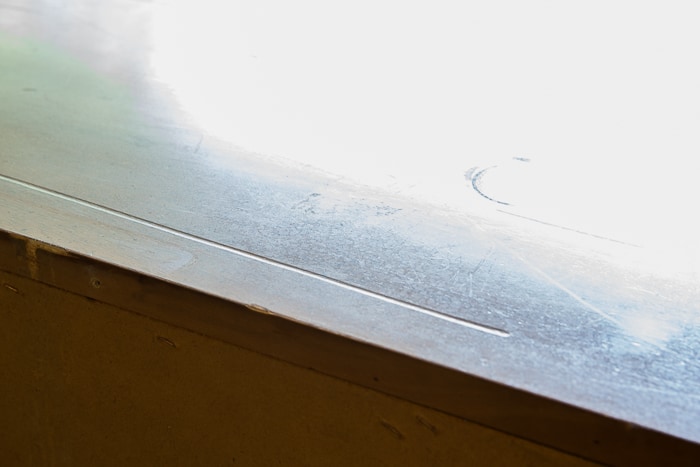 Picture of top of dresser showing a long gouge