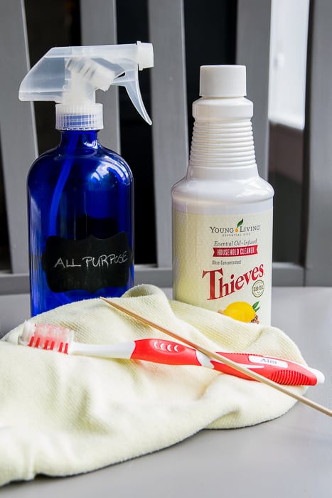 picture of cleaning spray, bottle, toothbrush, skewer and rag