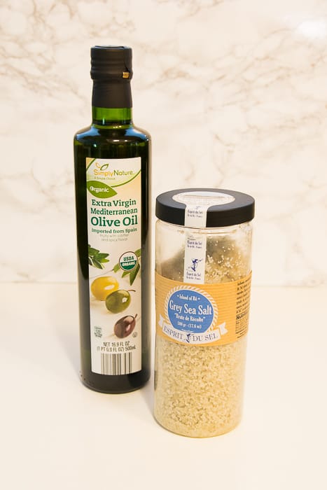 Picture of bottle of olive oil and canister of gray sea salt