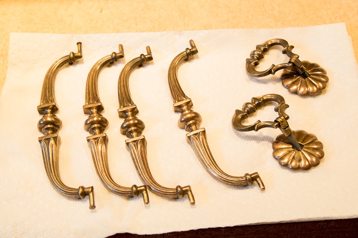 Picture of brass hardware drying on paper towel