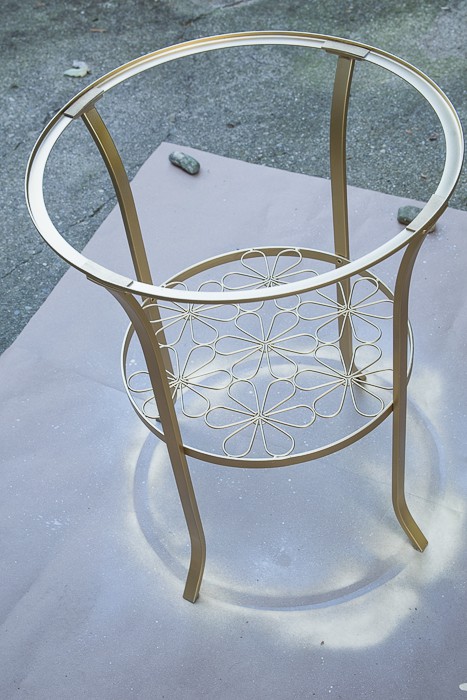 picture of round metal table spray painted gold