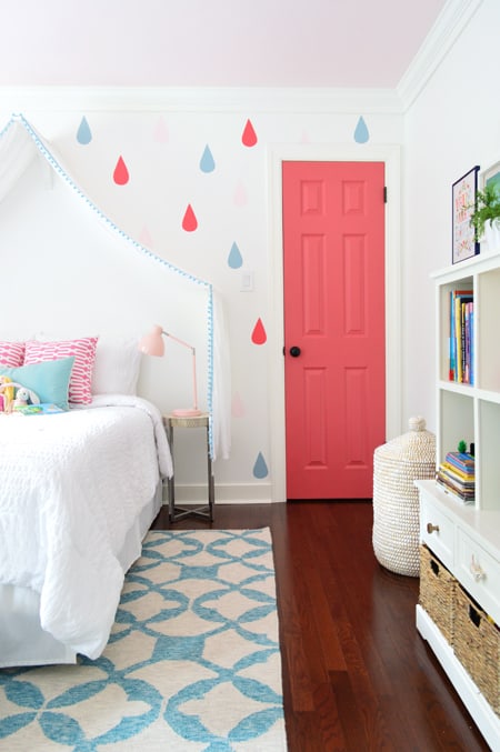 picture of a bedroom wall with rain drops and a pink door