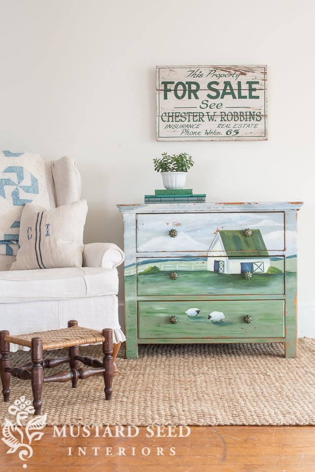 picture showing dresser painted with a farm landscape