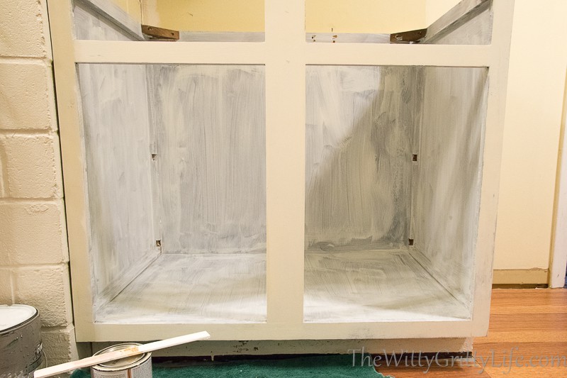 interior of cabinet with fist primer coat applied