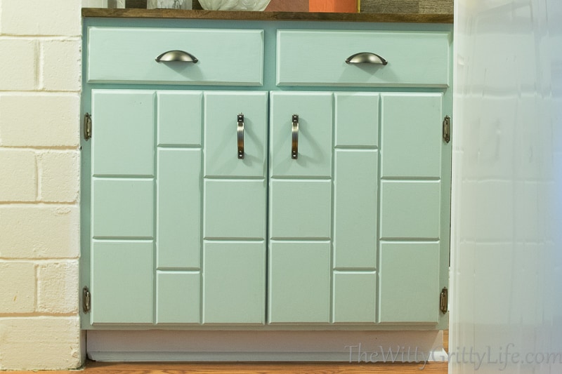 the cabinet fronts look like new with updated hardware and a new pale blue paint job