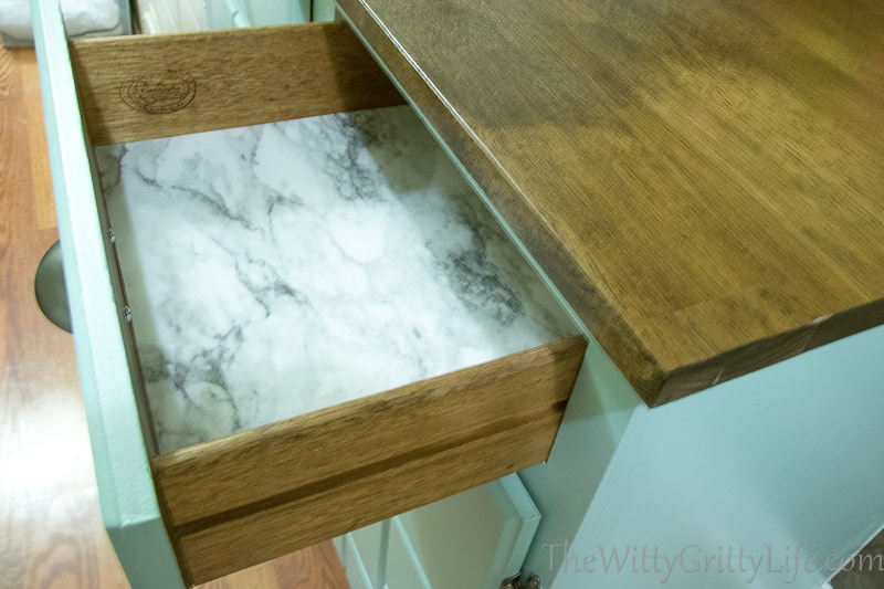 drawer all redone and lined with marble shelf paper