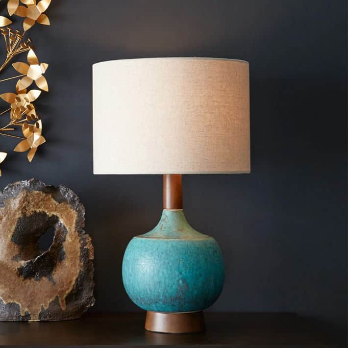 Teal ceramic and wood lamp with a drum shade, mid century modern style