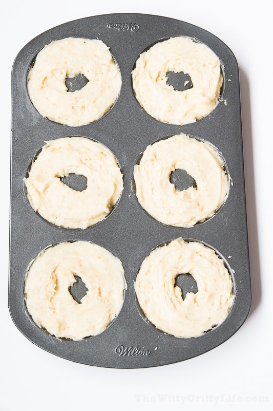 doughnut pan filled with batter for Easter Bunny nests