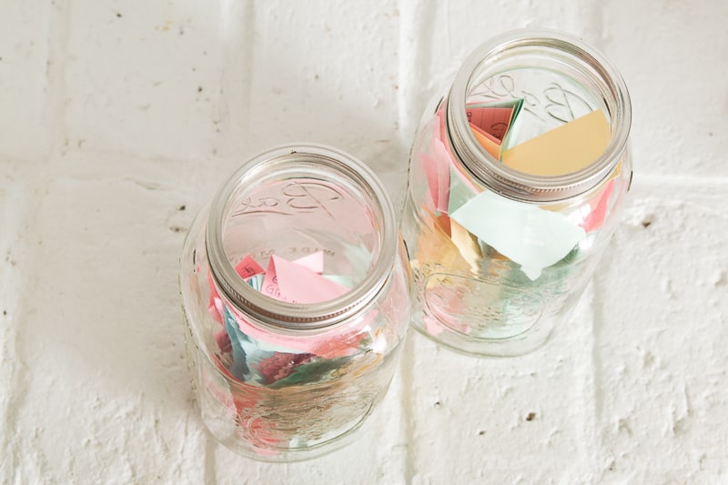 top view of two large jars with colored cards