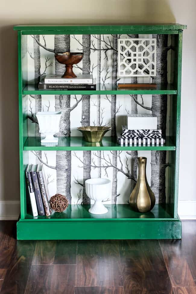 green book case with birch temporary wallpaper