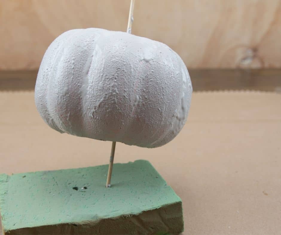 painted concrete pumpkin drying