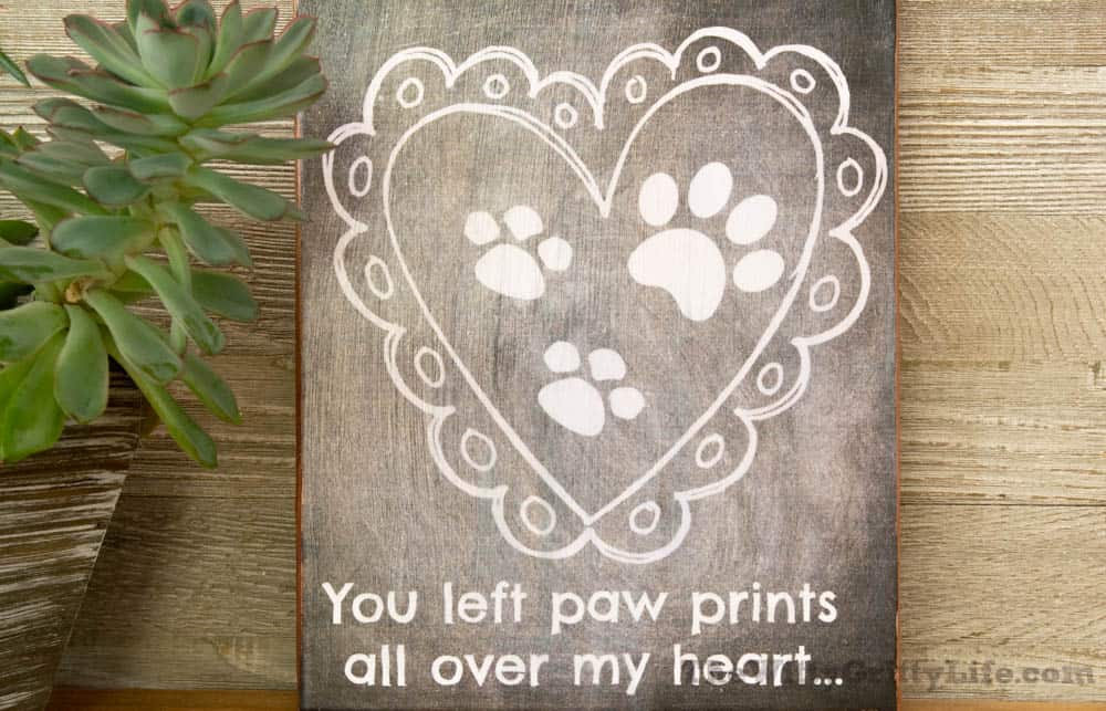 Diy wall sign with quote "you left paw prints all over my heart."