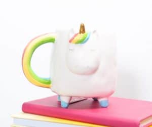 picture of unicorn mug on a stack of colorful books