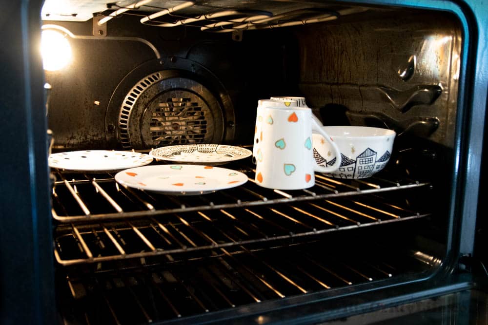 Sharpie painted dishes in the oven waiting to be baked and cured