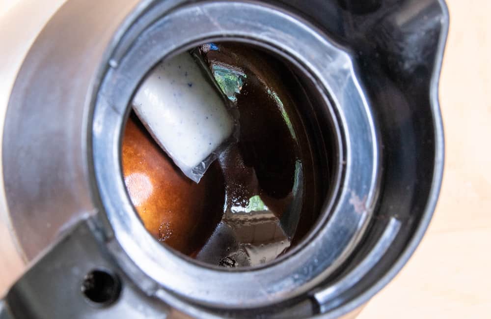 coffee pot with dishwasher packet at the bottom