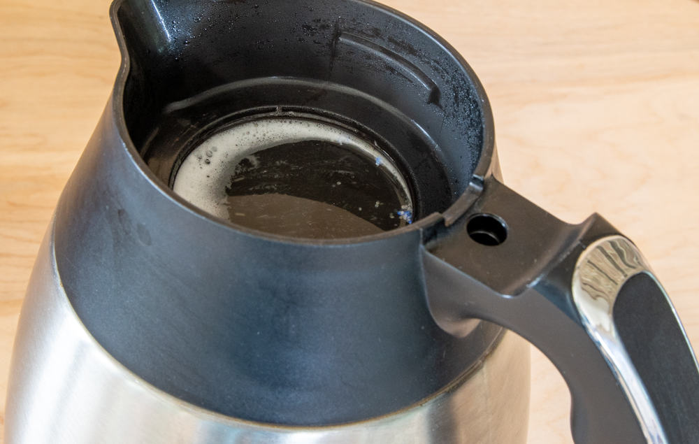 coffee pot with boiling water and dishwasher detergent