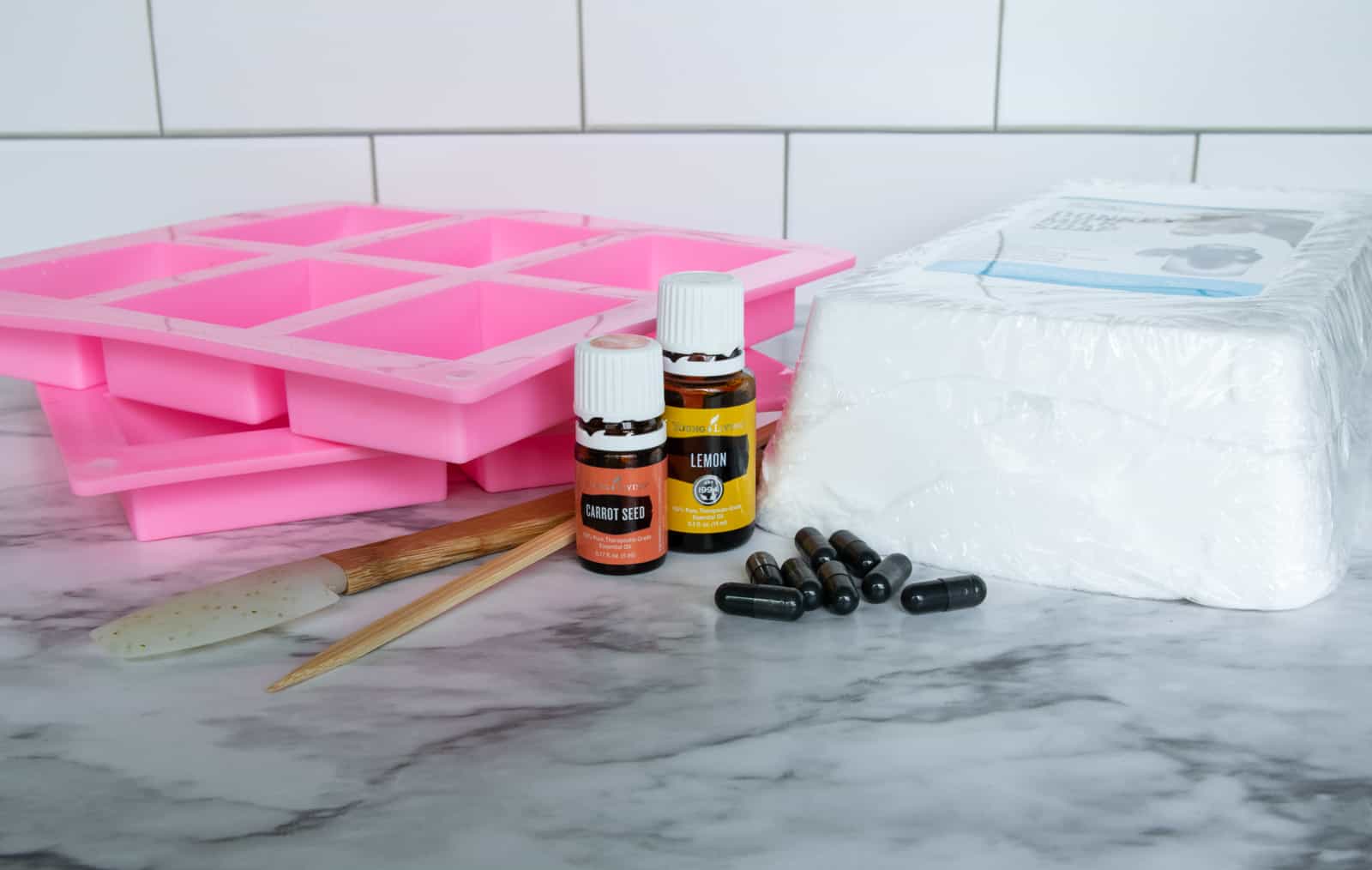 silicone soap molds, activated charcoal capsules, essential oils, tools and pour and melt soap block