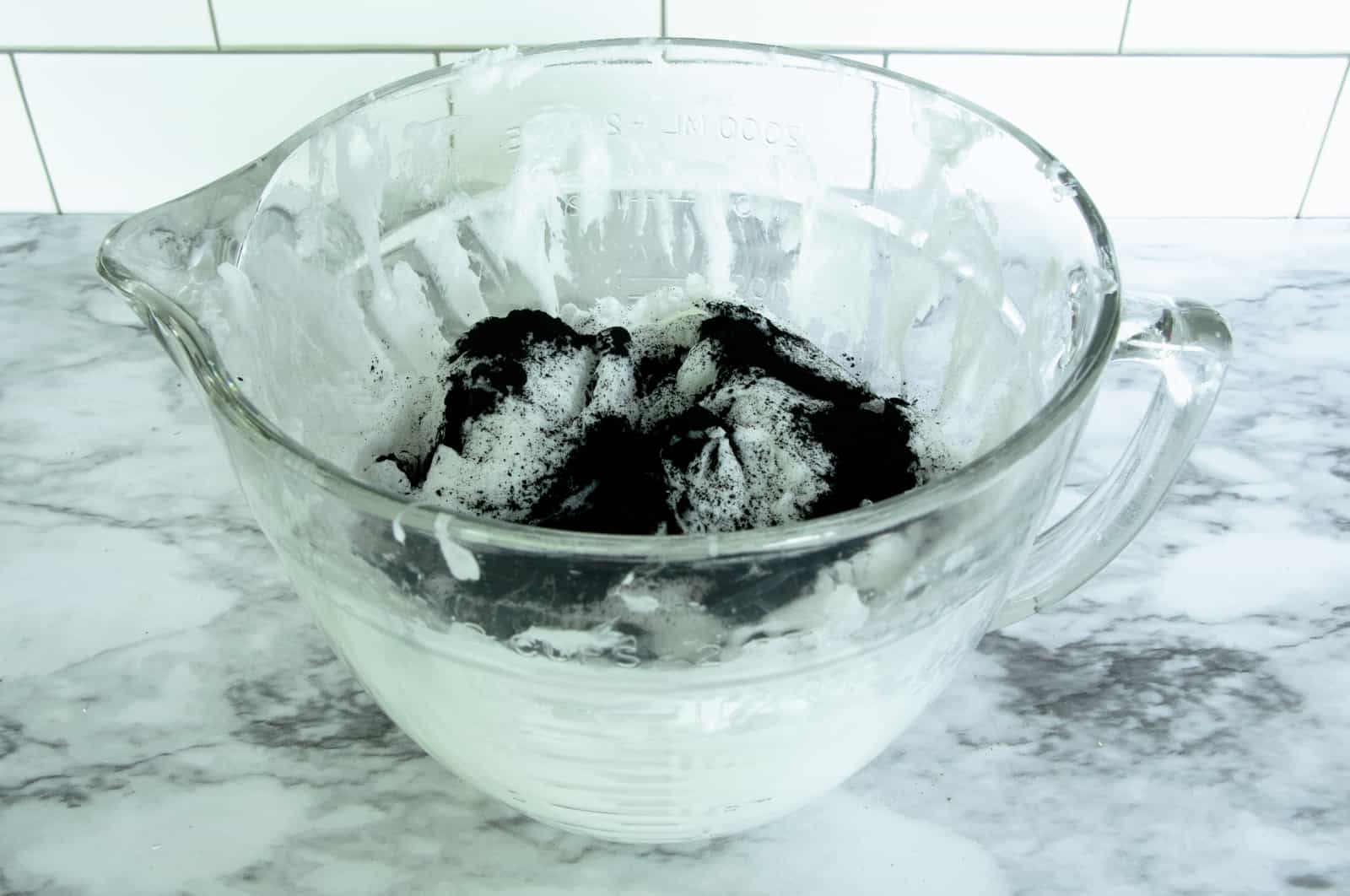 melted soap mixture with activated charcoal powder added