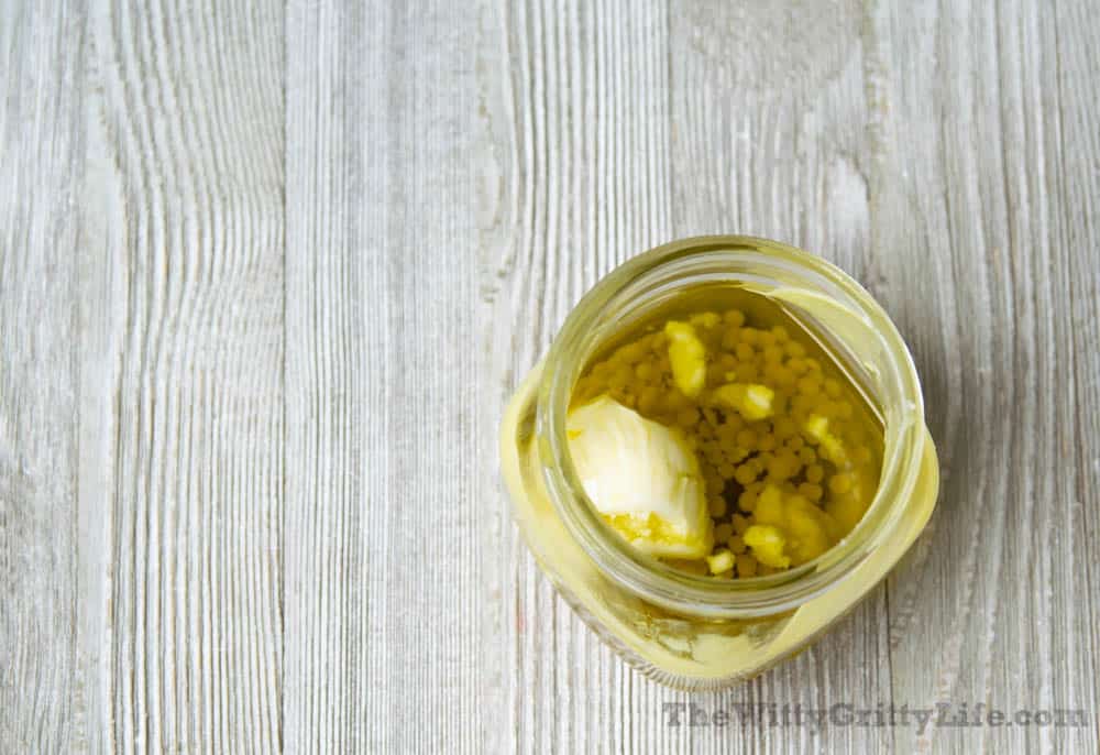 ingredients for homemade lip balm in mason jar