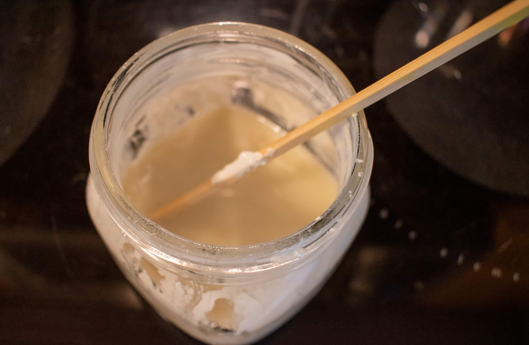 image showing deodorant mixture in jar with stir stick