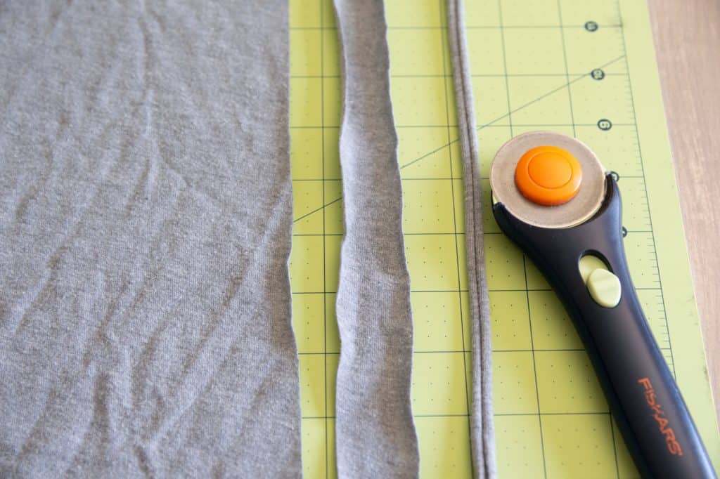 t shirt fabric cut into strips and rotary cutter