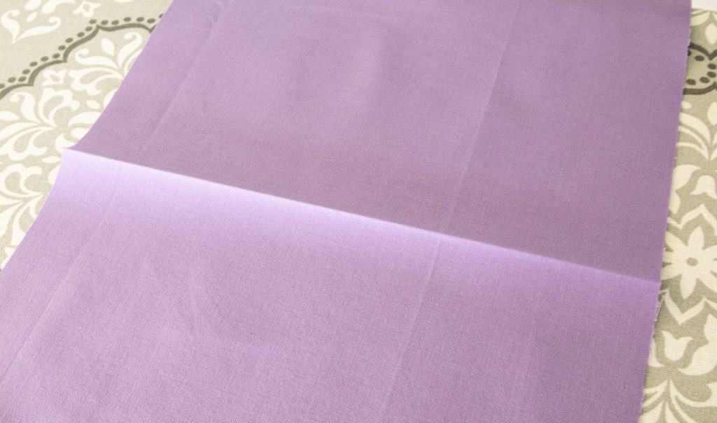 image showing fabric with pressed centerfold for washable face mask