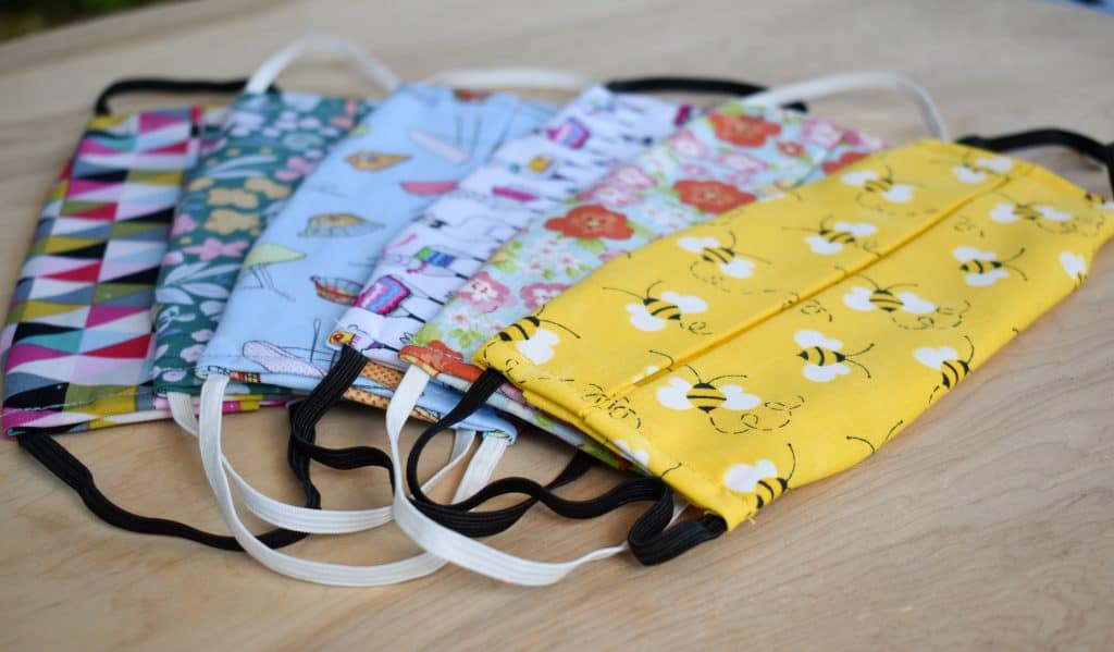 image of several washable cotton facemasks with filter pocket in various patterns and colors